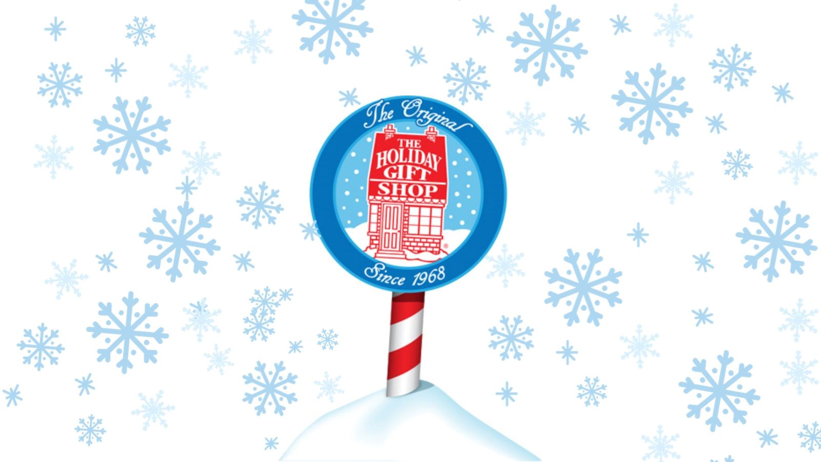 background of blue snowflakes with sign that says The Holiday Gift Shop on a red house